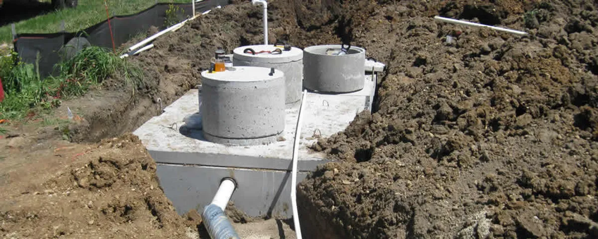 Septic system repair and installation site with tank access ports in Wellesley, MA